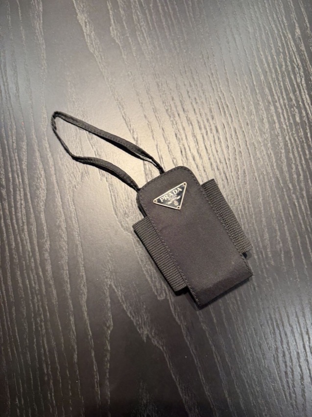 Prada black nylon cigarette case with triangle logo plaque and wrist strap