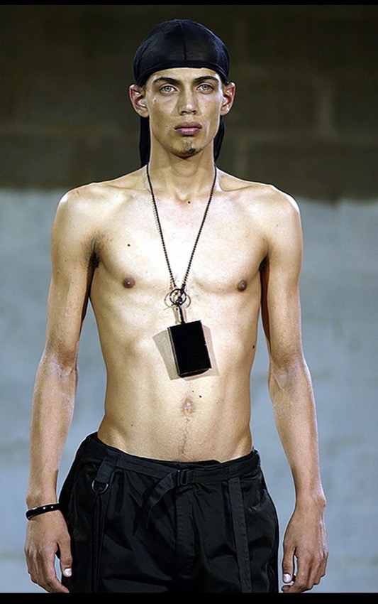 Raf Simons SS03 Consumed runway look with black cigarette case necklace